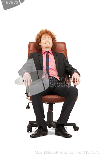 Image of young businessman sitting in chair