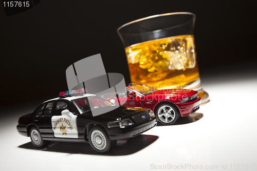 Image of Police and Sports Car Next to Alcoholic Drink