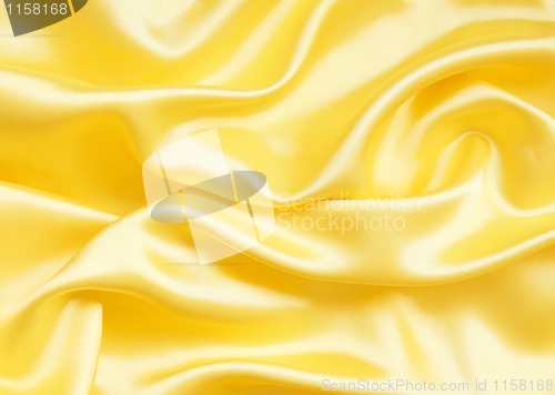 Image of Smooth elegant golden silk as background 