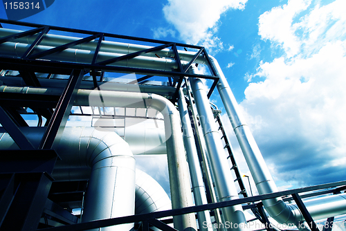 Image of Industrial zone, Steel pipelines in blue tones  