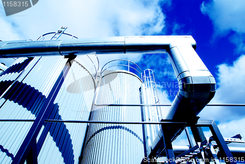 Image of Modern industrial factory against blue sky
