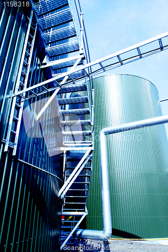 Image of Industrial zone, Steel pipelines in blue tones  