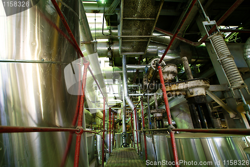 Image of Equipment, cables and piping as found inside of a modern industr