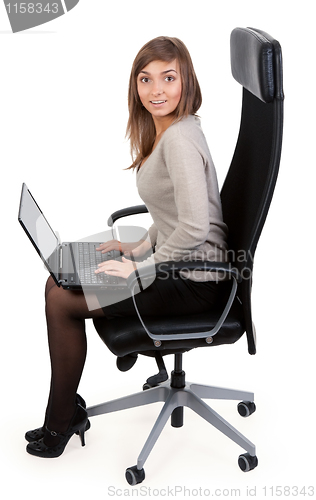 Image of girl in a chair with a laptop
