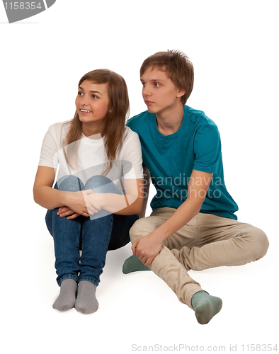 Image of boy and girl sitting on the floor
