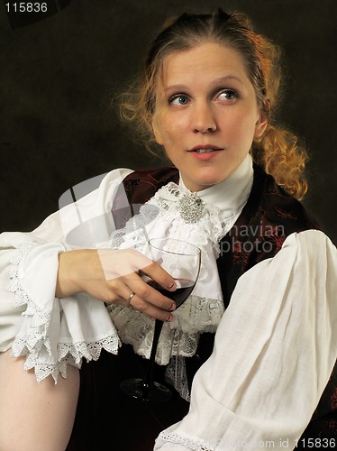 Image of Woman with cup of red wine