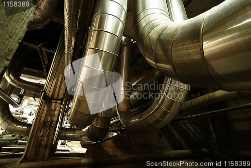 Image of Equipment, cables and piping as found inside of a modern industr