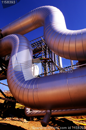 Image of Industrial zone, Steel pipelines at sunset