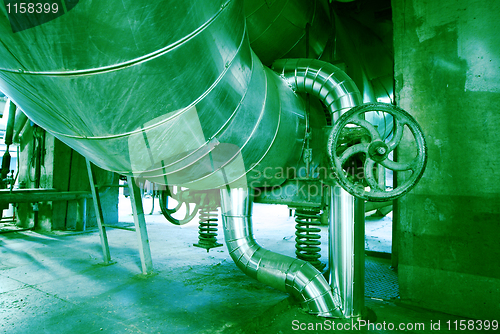 Image of Equipment, cables and piping as found inside of a modern industr