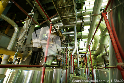 Image of Equipment, cables and piping as found inside of a modern industr