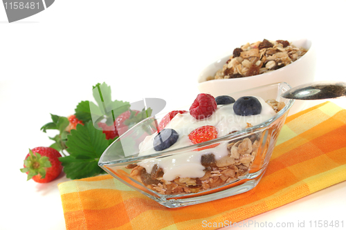 Image of muesli with yogurt, fresh fruit and nuts