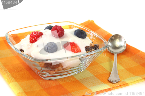 Image of muesli with yogurt, fresh fruit and nuts