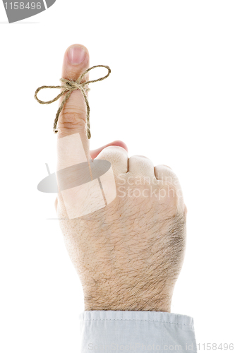 Image of String tied on finger as reminder