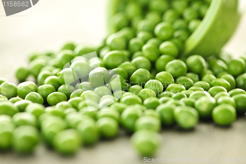 Image of Spilled bowl of green peas