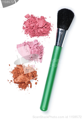 Image of Crushed cosmetics with makeup brush