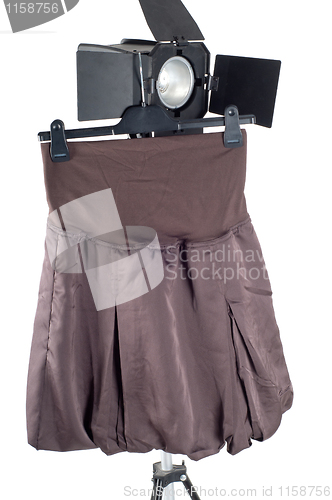 Image of Skirt hanging on studio lighting