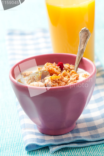 Image of Breakfast with cereal with orange juice