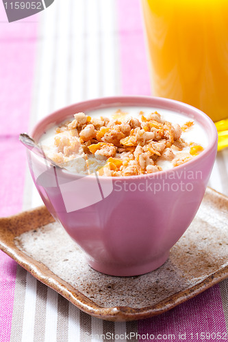 Image of Breakfast with cereal with orange juice