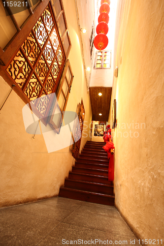 Image of Chinese traditional corridor in wooden with red lantern.