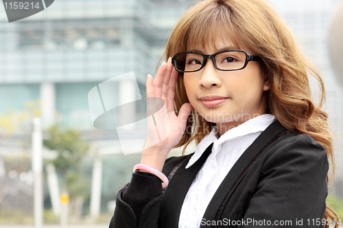 Image of Great smiling outdoor young executive 