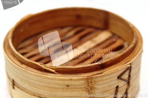 Image of Chinese steamed dimsum in bamboo containers traditional cuisine 