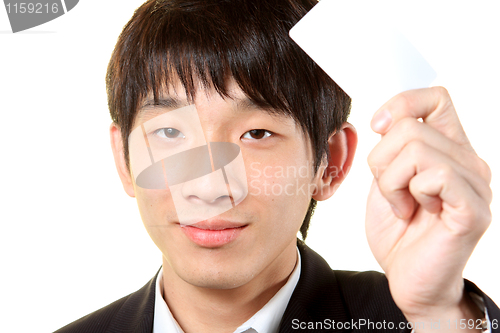 Image of businessman with empty card in hand 