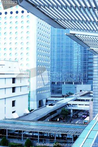 Image of cityscape with office buildings and bridge in Hong Kong. 