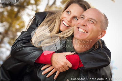 Image of Attractive Couple in Park with Leather Jackets