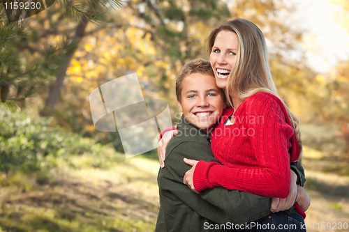 Image of Playful Mother and Son Pose for a Portrait Outdoors