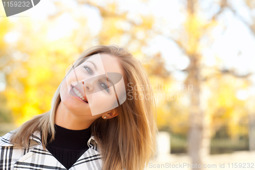 Image of Pretty Young Woman Smiling in the Park