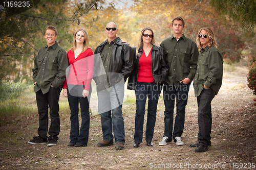 Image of Attractive Family Portrait Walking Outdoors