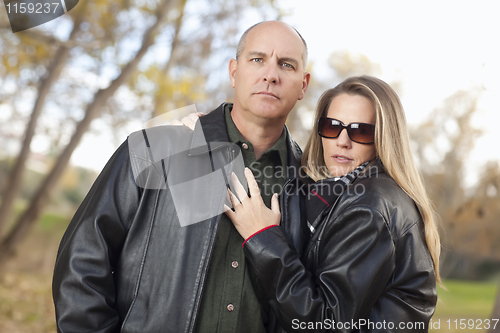 Image of Attractive Couple in Park with Leather Jackets