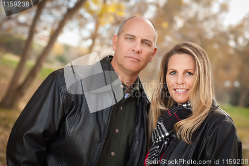 Image of Attractive Couple in Park with Leather Jackets