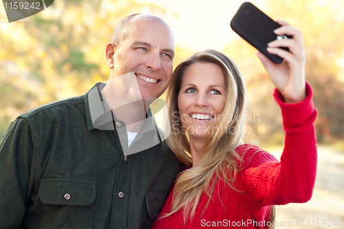 Image of Attractive Couple Pose for a Self Portrait Outdoors