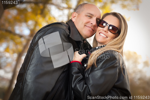 Image of Attractive Couple in Park with Leather Jackets