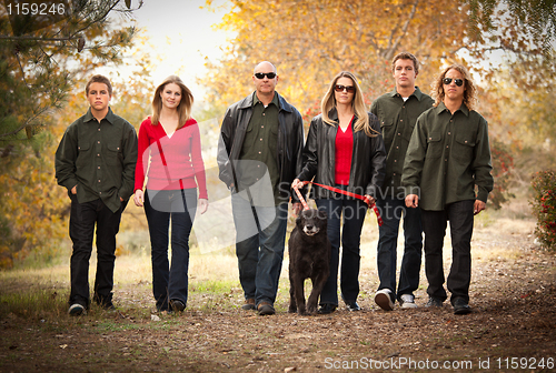 Image of Attractive Family Portrait Walking Outdoors