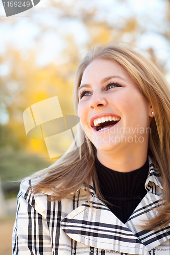 Image of Pretty Young Woman Smiling in the Park
