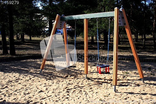 Image of wooden swing on a children's playground