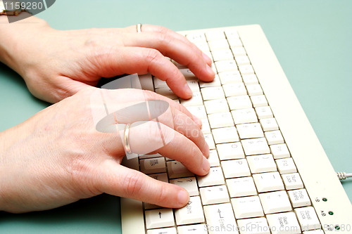 Image of Female hands on the keyboard