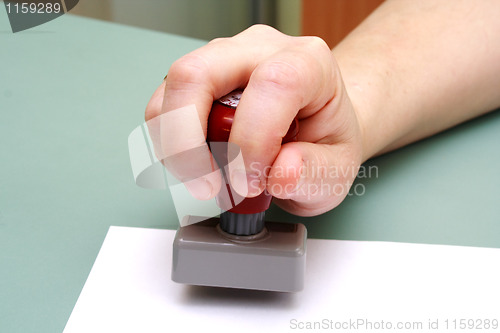 Image of doctor stamp in the women hand