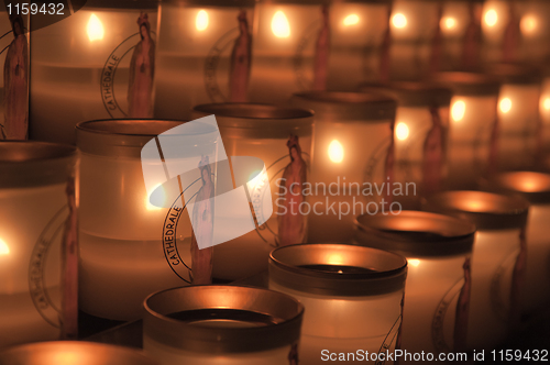 Image of Candles burning in church