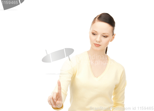 Image of businesswoman working with something imaginary