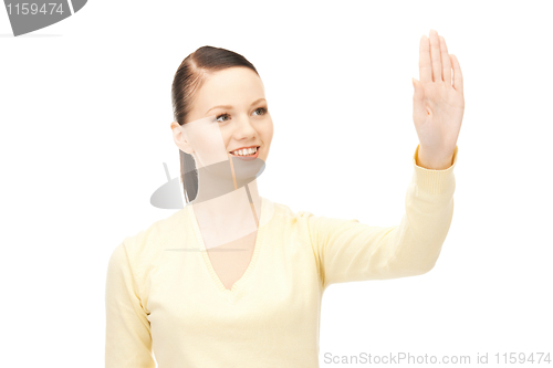Image of businesswoman working with something imaginary