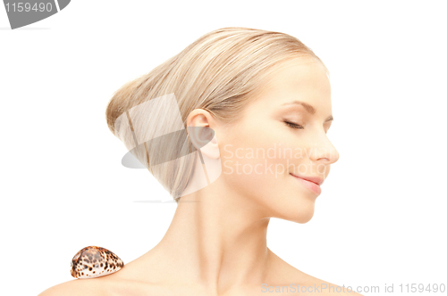 Image of beautiful woman with seashell