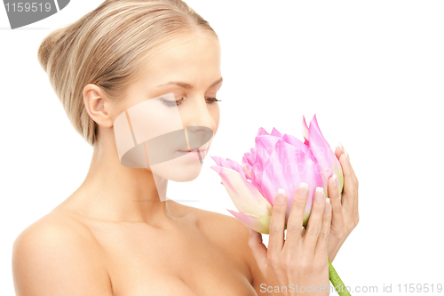 Image of beautiful woman with lotus flower