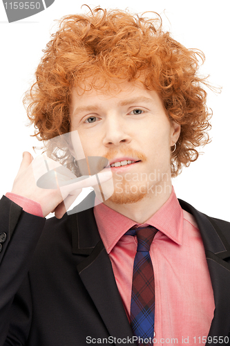 Image of man making a call me gesture