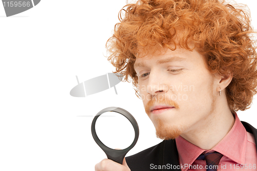 Image of man with magnifying glass