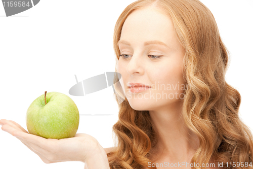 Image of young beautiful woman with green apple