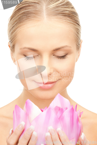 Image of beautiful woman with lotus flower