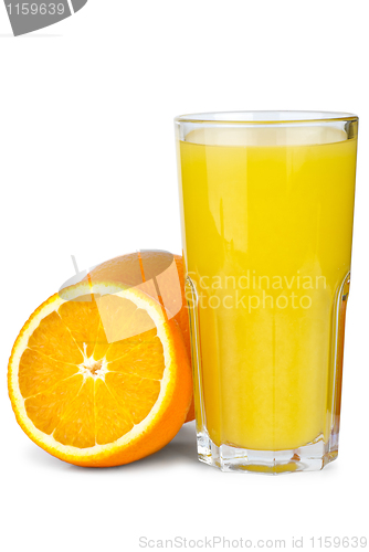 Image of Drinking glass with orange juice and oranges near